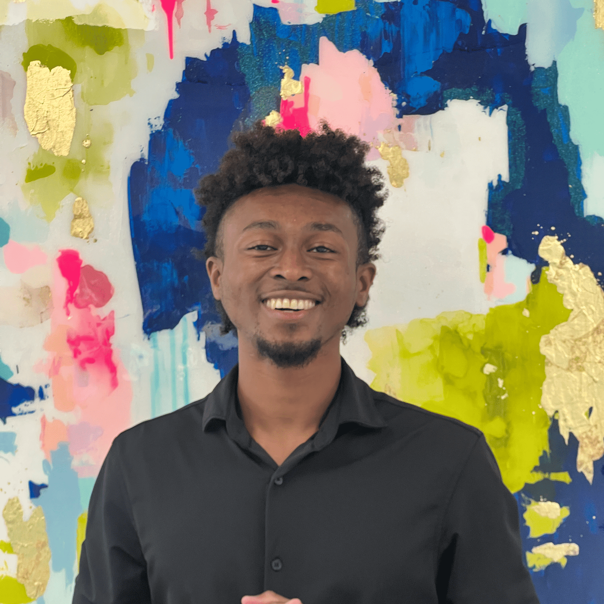 Portrait of Jayden, a professional stylist at Pura Vida Salon, showcasing their expertise and style.