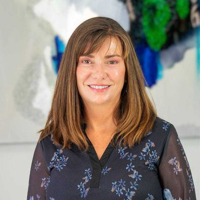 Portrait of Lisa Langelier, a professional stylist at Pura Vida Salon, showcasing their expertise and style.